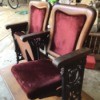 Identifying Theater Seats and Age - upholstered seats, with wood trim, and ornate cast sides