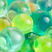 Hydrogel beads in yellow, blue and green.