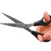 A hand holding a pair of scissors.