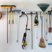 Neatly stored tools on a garage wall.