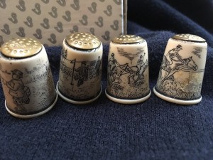 Finding the Value of Collectible Thimbles - four thimbles with images of polo players, fisherman, jockey, and golfer