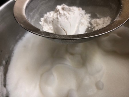 sifting flour in bowl