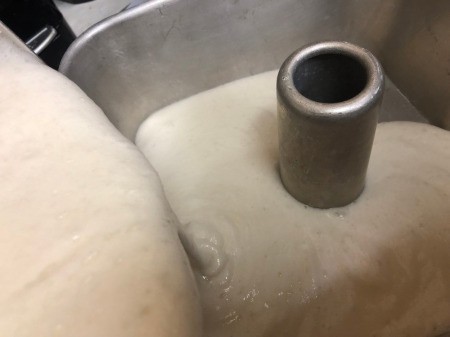 pouring batter in tube pan