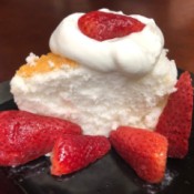 Angel Food Cake with Strawberries and Cream on plate