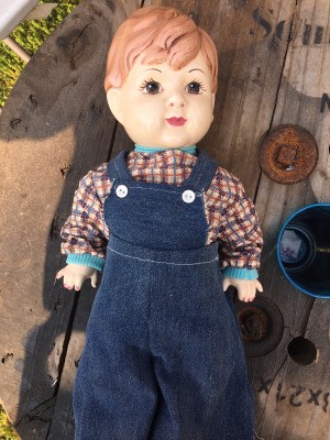 Identifying a Porcelain Doll - boy doll wearing overalls