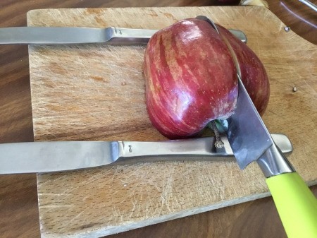 Edible Apple Swan - prop the apple up on two butter knives and cut down, slightly off the core, until you hit the knives