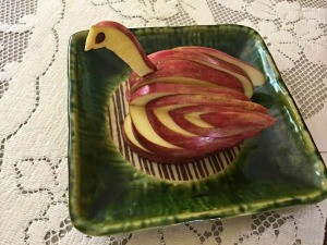 Edible Apple Swan - swan on a green ceramic dish