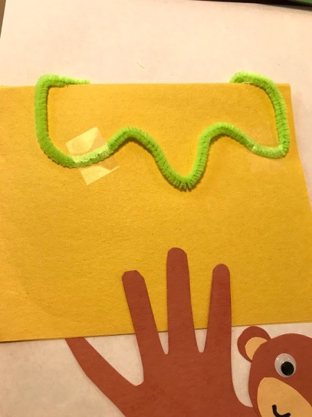 Toddler Handprint Monkey Father's Day Card - add a pipe cleaner branch to a folded piece of paper for the card and then glue monkey in place
