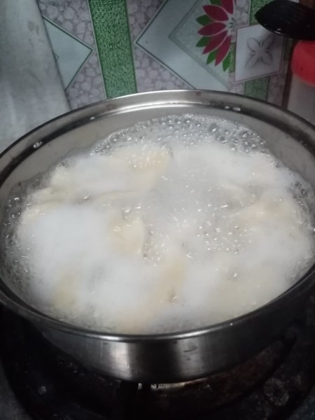 simmering dough in pan