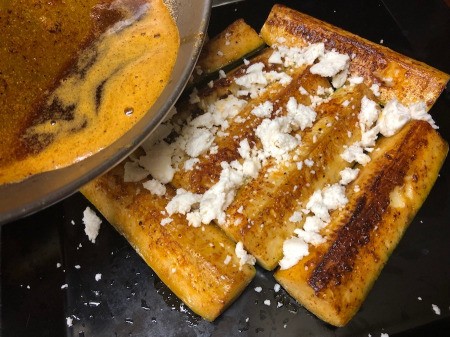 cheese &butter on zucchini quarters
