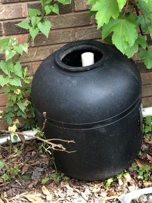 Garden Uses for an Empty Pool Filter - black plastic drum