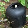 Garden Uses for an Empty Pool Filter - black plastic drum