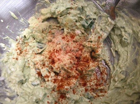 adding paprika to sauce