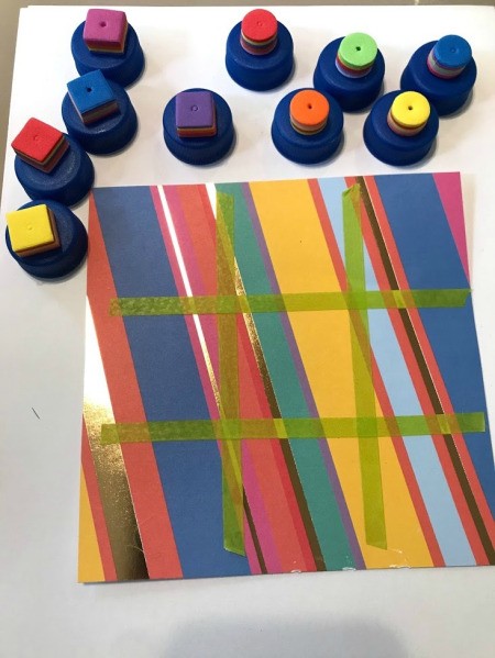How to Make a Travel Tic Tac Toe Game - hot glue the foam circles and squares to the bottle caps