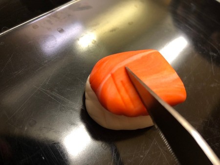 Fondant Sushi Cupcake Toppers - place the salmon on the rice ball and then use the small knife to add indentations to the salmon