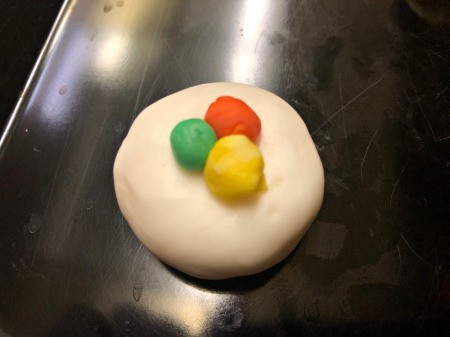 Fondant Sushi Cupcake Toppers - flatten a ball of white fondant for a California roll and add three different color balls of fondant