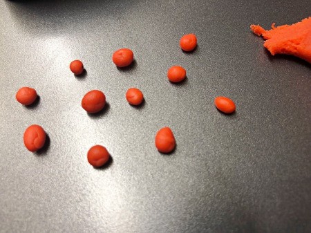 Fondant Sushi Cupcake Toppers - mix more red and yellow fondant and make small balls - don't over roll thereby keeping them sticky