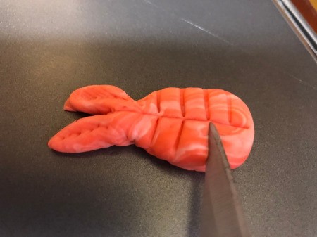 Fondant Sushi Cupcake Toppers - use knife to make an indentation on the tail parts, and then add indentations to the body