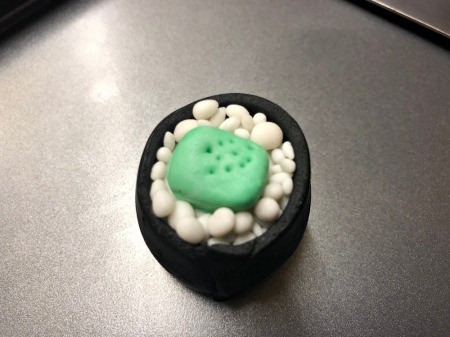 Fondant Sushi Cupcake Toppers - mimic seeds by poking the green bit with a toothpick and then add rice grains around it