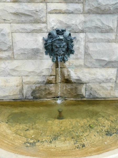 An old fountain depicting Bacchus, god of wine.