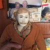 Identifying a Porcelain Doll - male doll wearing a plaid shirt and brown sweater