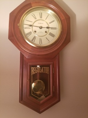 Value of a Regulator Wall Clock - wall clock with a pendulum
