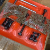 Identifying Small Tan Balls in Furniture Box - balls under tape in  shipped furniture box