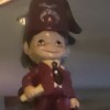 Identifying Figurines - figurine of a Mason member with fez and symbol
