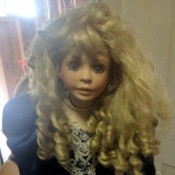 Value of a Circle of Friends Doll - large doll wearing a dark blue dress with lace at cuffs and hem