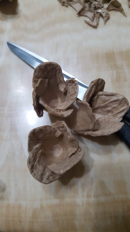 Making Egg Carton Flowers  - compress the petals, folding one over the other
