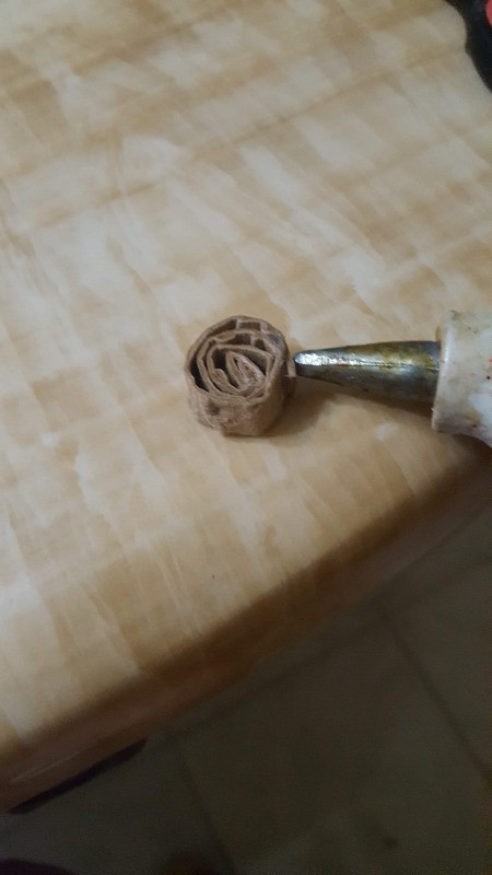 Making Egg Carton Flowers  - roll and secure with hot glue