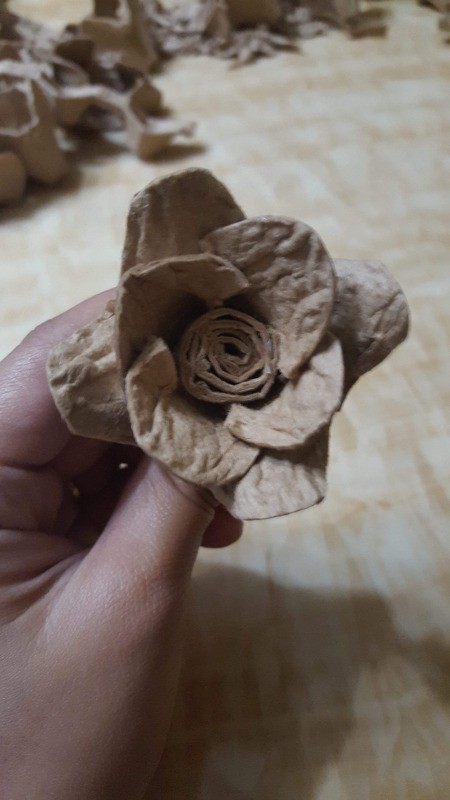 Making Egg Carton Flowers - place two flowers together and add the roll to the center