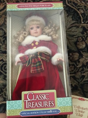 A collectible doll in a box.