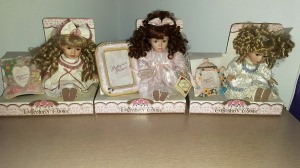Value of Collector's Choice Porcelain Dolls - three dolls in partial boxes