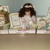 Value of Collector's Choice Porcelain Dolls - three dolls in partial boxes