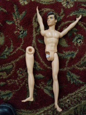 Fixing the Leg on a Ken Doll - Ken doll with a detached leg