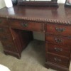 Finding the Value of an Old Desk - nine drawer desk with decorative edge around the desktop