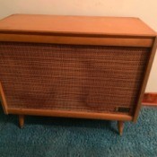Value of Zenith Cabinet Record Player - rather plain stereo cabinet with large area covered with cloth over the speakers