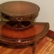 Background Information on an Antique Table Set - two leather topped tables, one round one half round