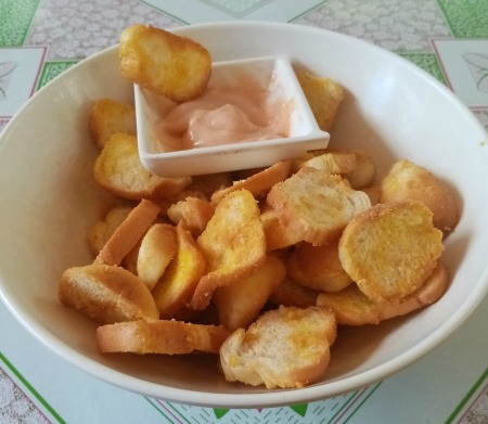 Bread Chips on plate with dipping sauce