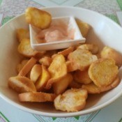 Bread Chips on plate with dipping sauce