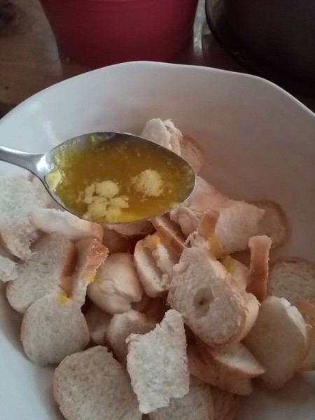 spooning butter on Bread Chips