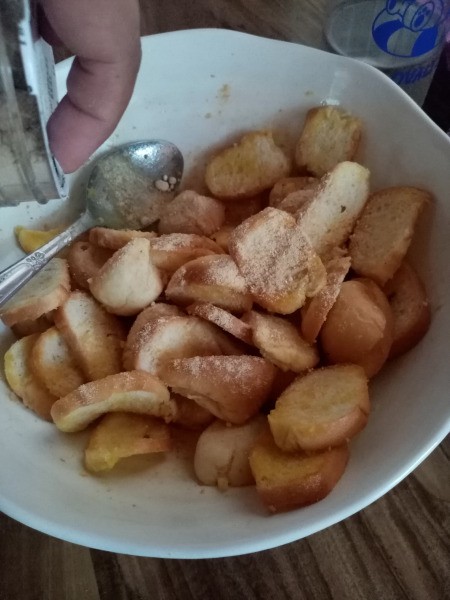 sprinkling salt on Bread Chips
