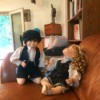 Value of Porcelain Dolls -  boy and girl doll on a couch
