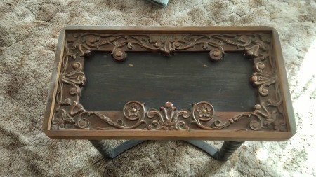 A small carved vintage table.
