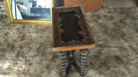 A small carved vintage table.