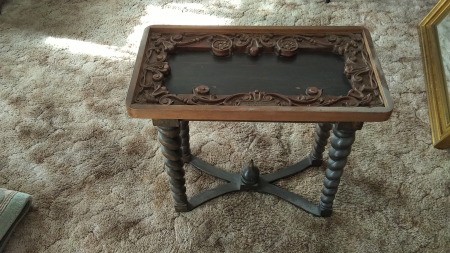 A small carved vintage table.