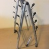 Identifying a Metal Stand - A shaped tubular metal stand with places to hang something
