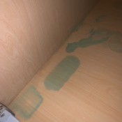 Removing a Windex Stain on Bathroom Cabinet - blue stains on bottom of cabinet