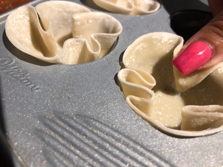 lining muffin tin cups with wrapper